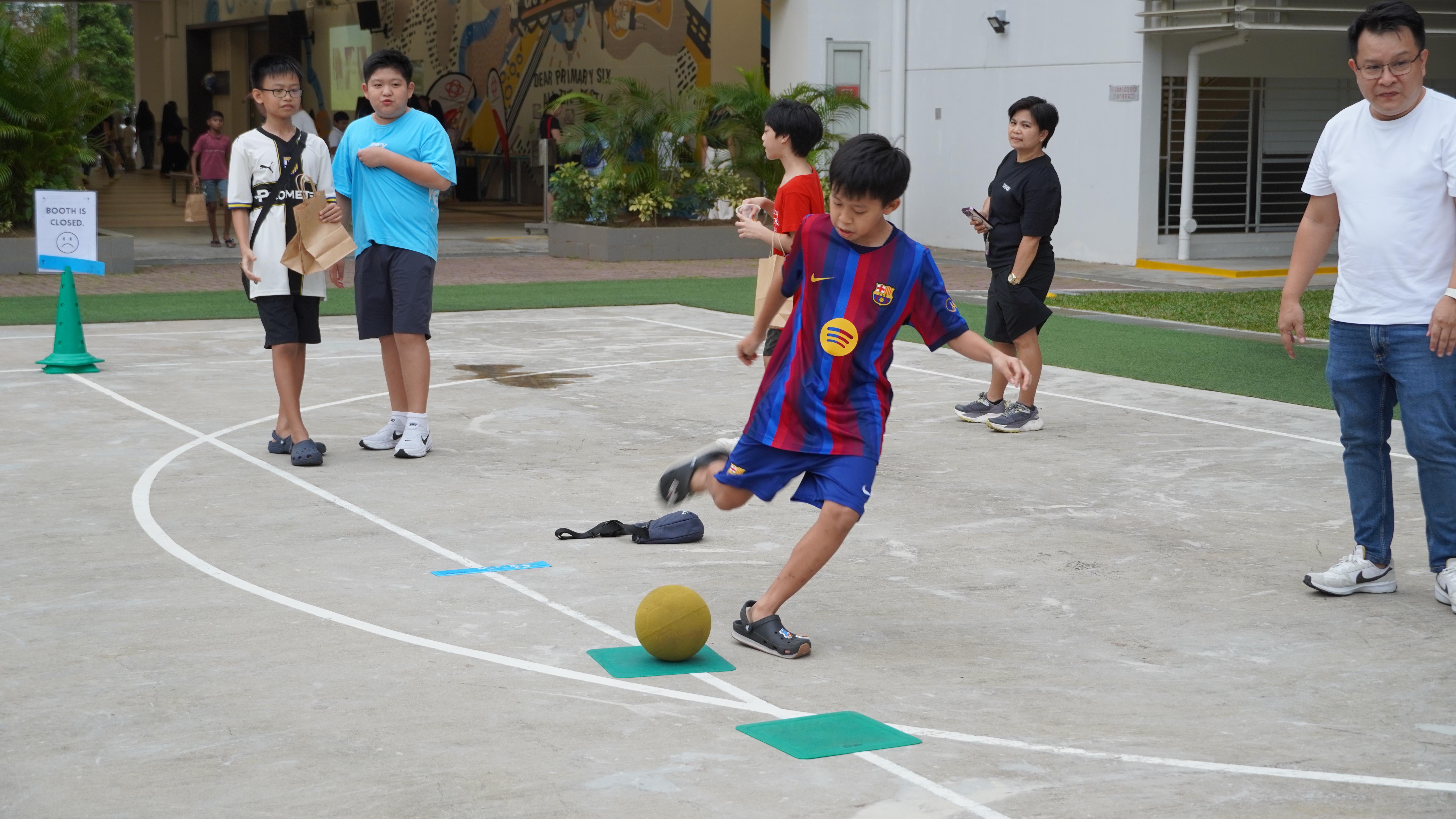Going for goal! Our student lines up his kick and gives the ball his best shot.